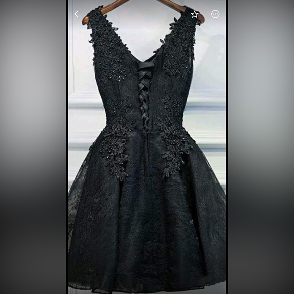 Black short style prom dress. Lace design along the top. Sheer bottom. Size 4 - Picture 2 of 3